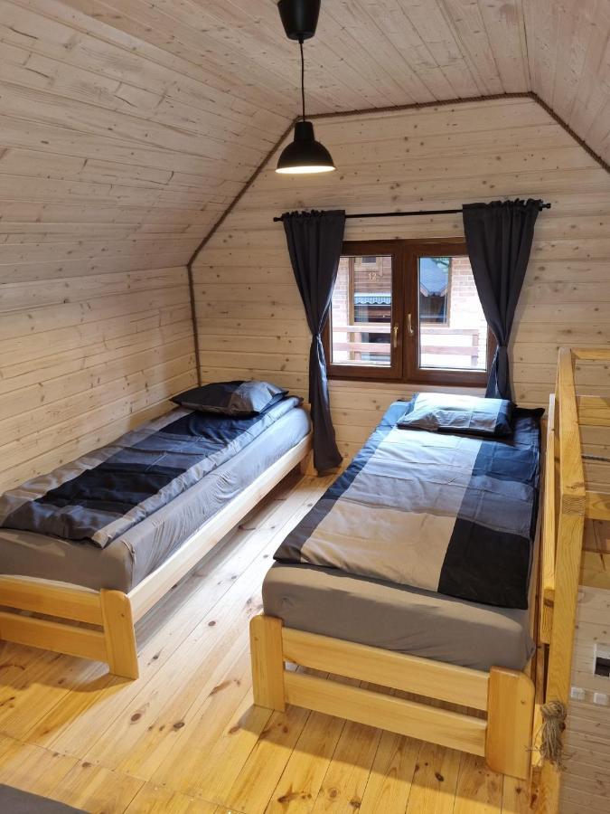 Domki Pod Debami Поберово Экстерьер фото